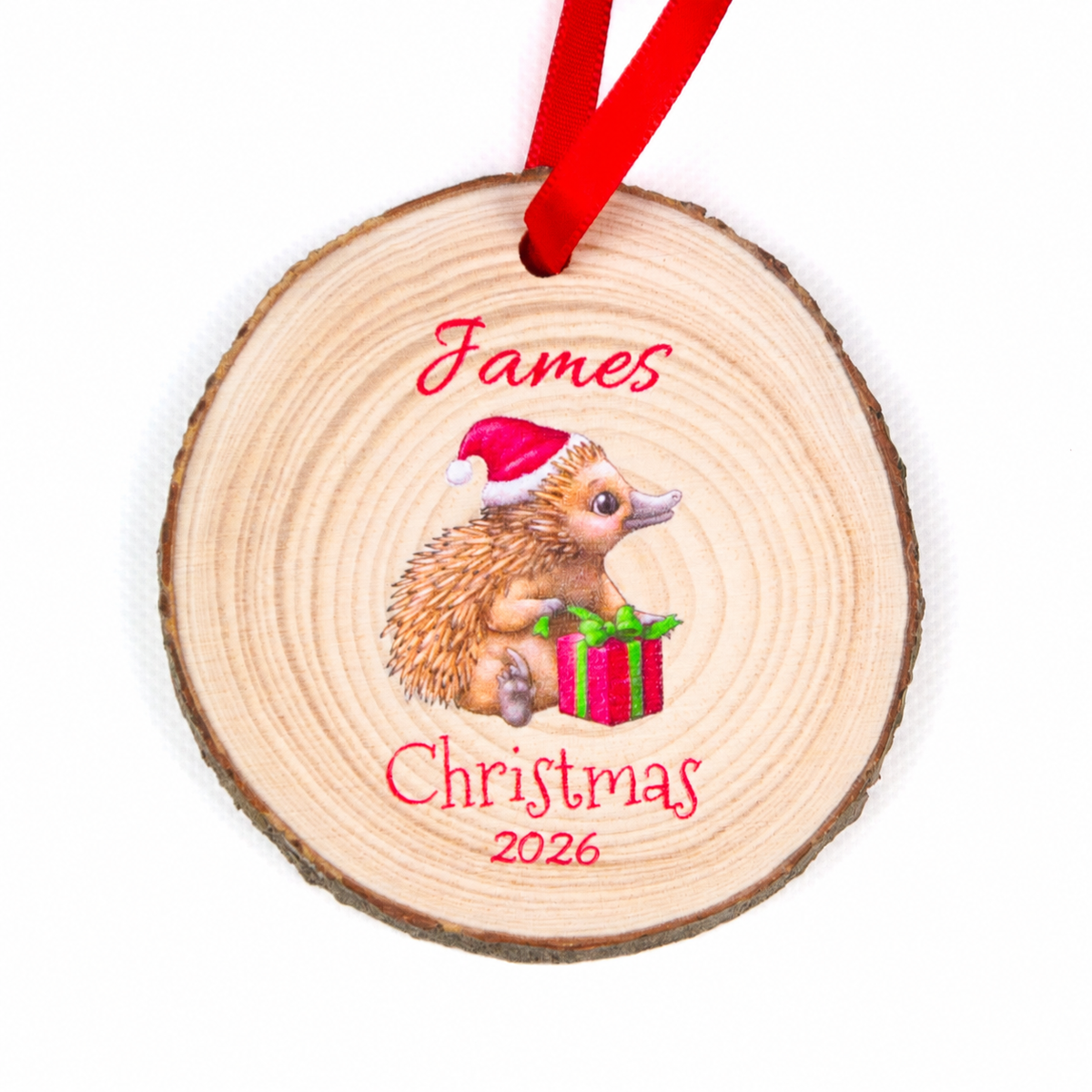 Personalised echidna Christmas 2026 wood slice ornament with red ribbon on a white background.